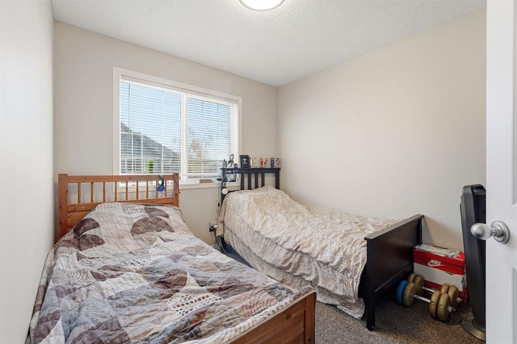 168 Copperfield Court Se, Calgary, AB - Indoor Photo Showing Bedroom