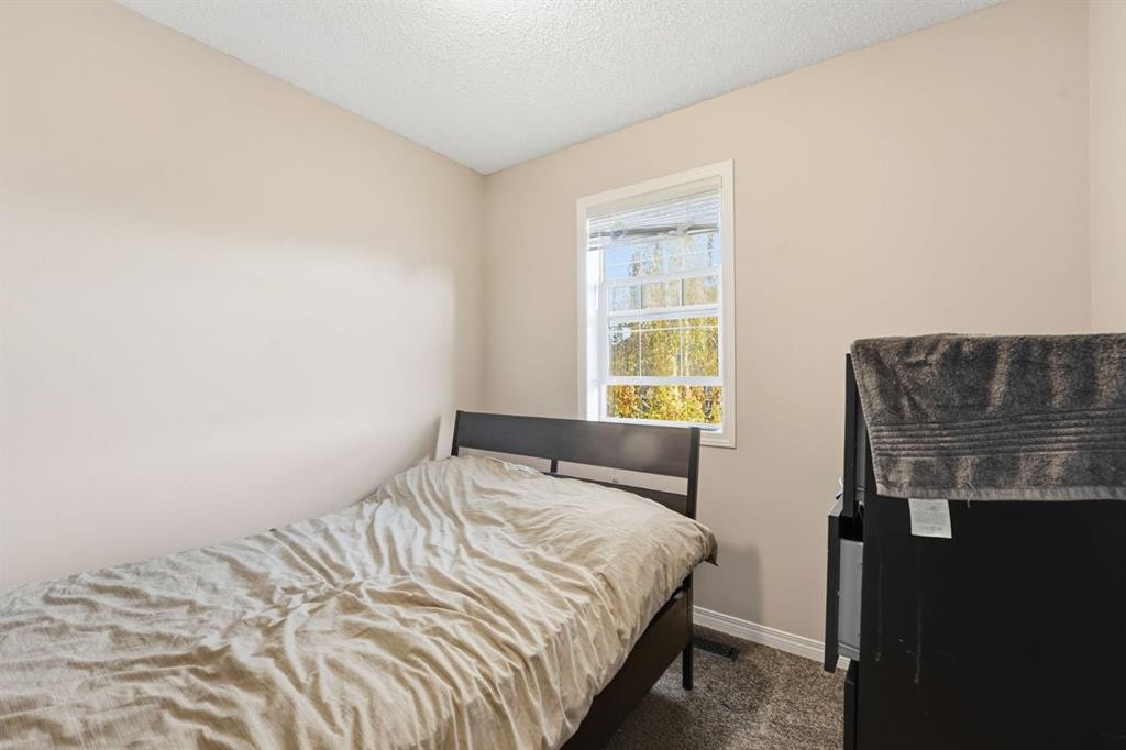 168 Copperfield Court Se, Calgary, AB - Indoor Photo Showing Bedroom