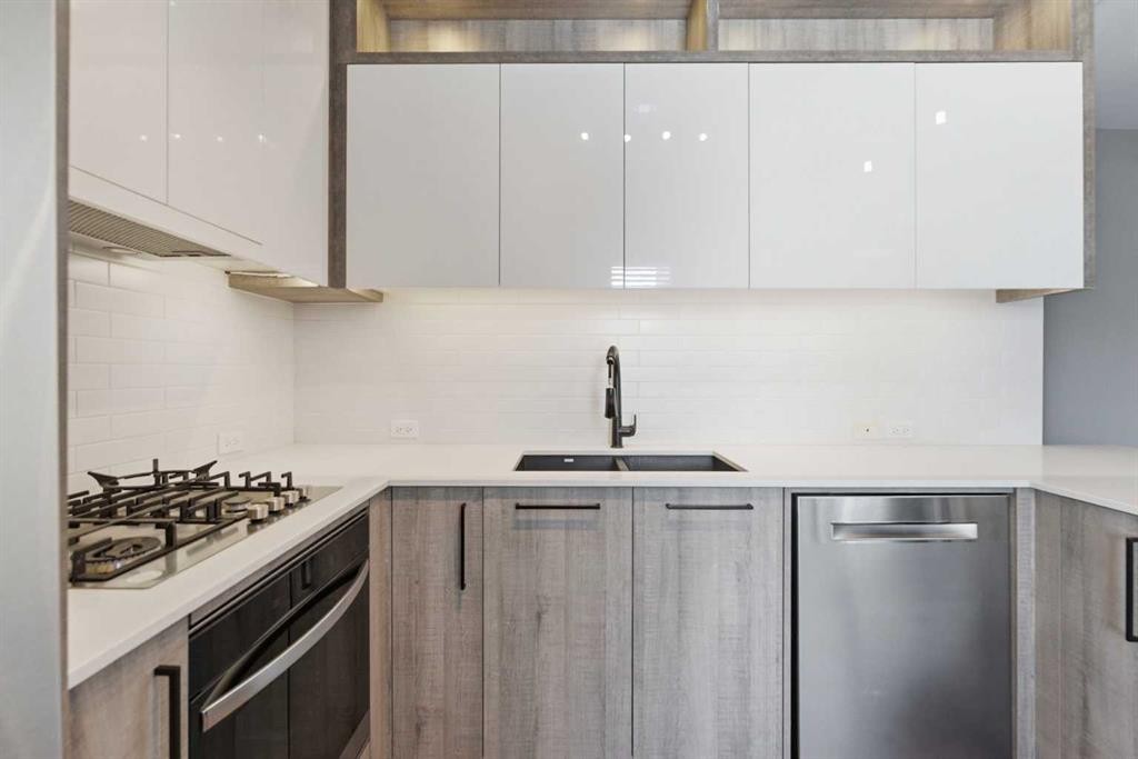 209-2702 17 Avenue Sw, Calgary, AB - Indoor Photo Showing Kitchen With Double Sink With Upgraded Kitchen