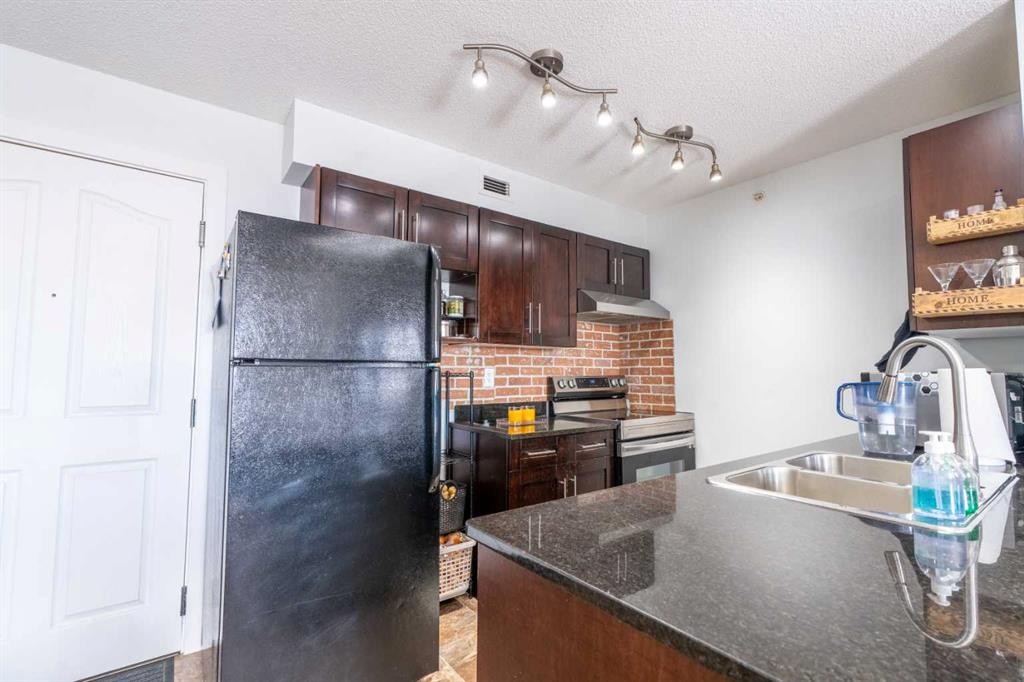 425-355 Taralake Way Ne, Calgary, AB - Indoor Photo Showing Kitchen With Double Sink