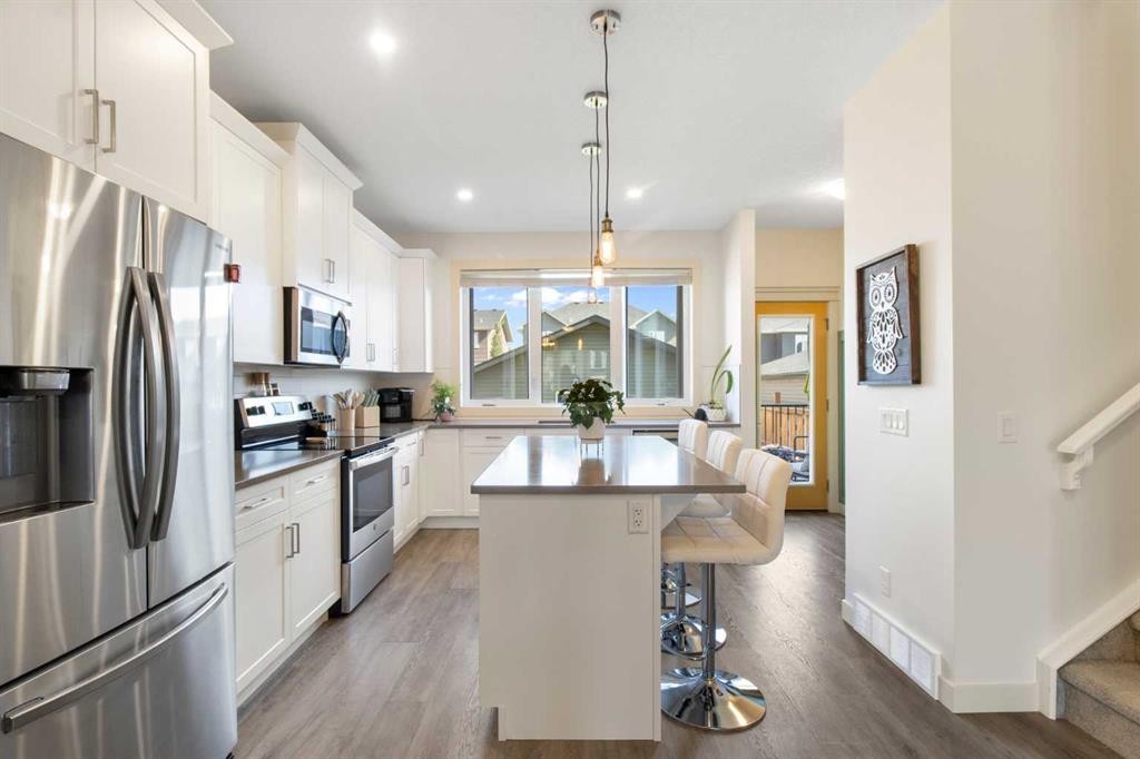 112 Fireside Crescent, Cochrane, AB - Indoor Photo Showing Kitchen With Stainless Steel Kitchen With Upgraded Kitchen