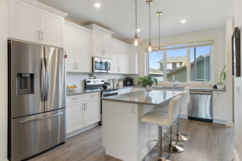 112 Fireside Crescent, Cochrane, AB - Indoor Photo Showing Kitchen With Stainless Steel Kitchen With Upgraded Kitchen