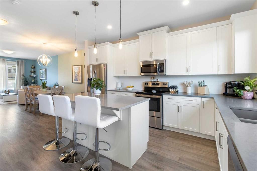 112 Fireside Crescent, Cochrane, AB - Indoor Photo Showing Kitchen With Stainless Steel Kitchen With Upgraded Kitchen