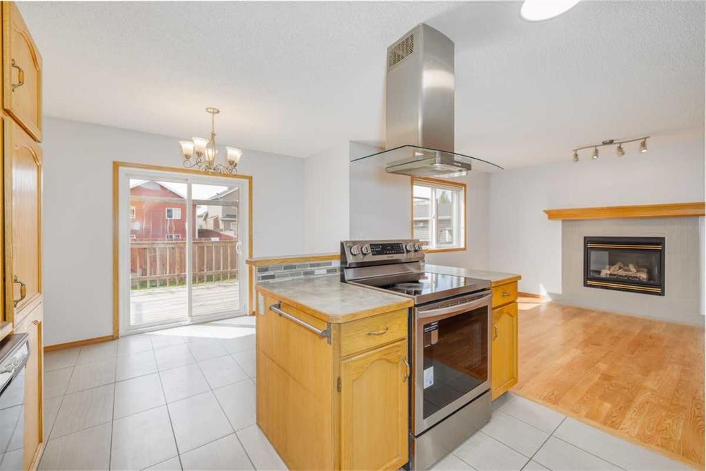 6013 Saddlehorn Drive Ne, Calgary, AB - Indoor Photo Showing Other Room With Fireplace