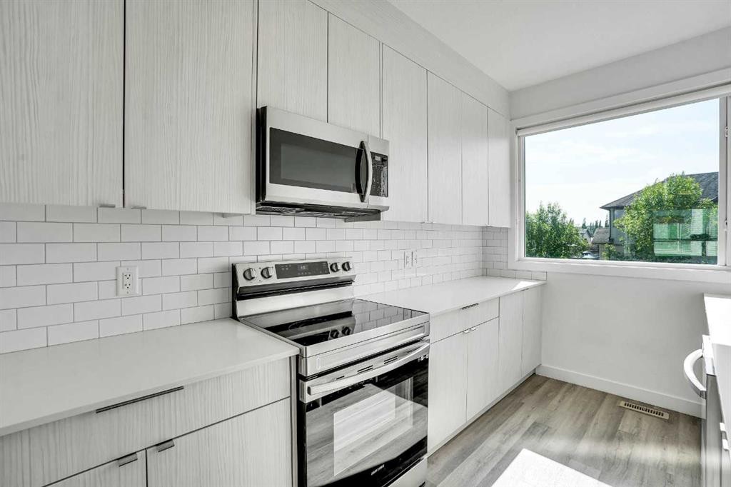 105 Panatella Square Nw, Calgary, AB - Indoor Photo Showing Kitchen