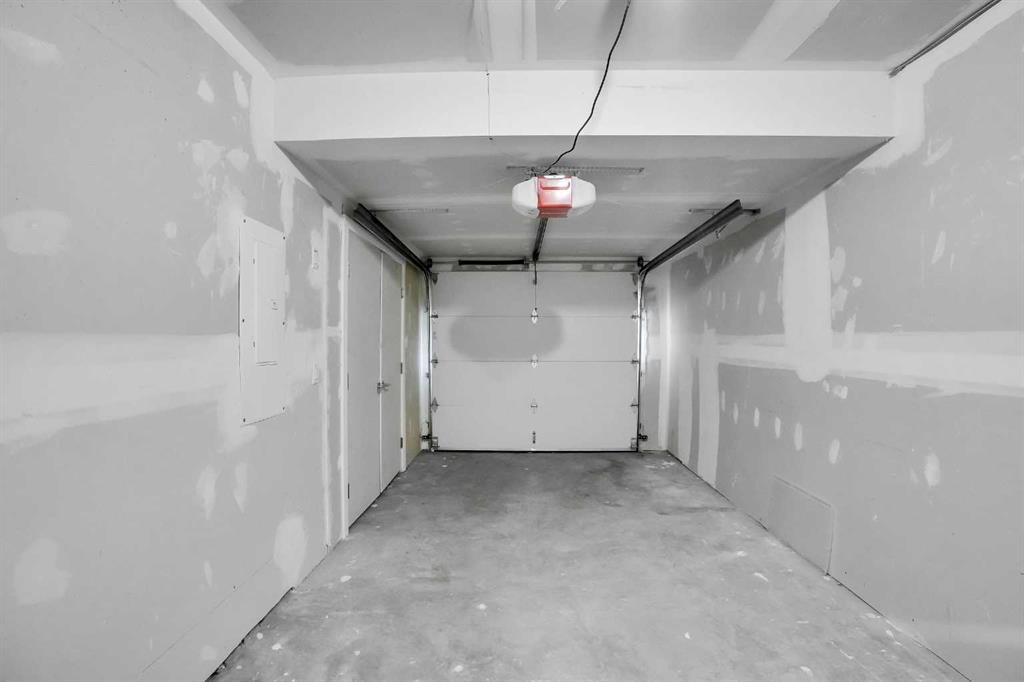 105 Panatella Square Nw, Calgary, AB - Indoor Photo Showing Garage
