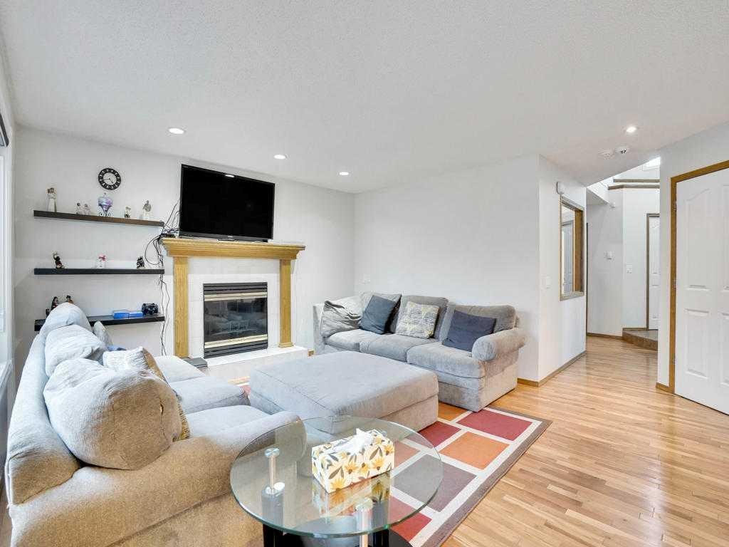 151 Citadel Park Nw, Calgary, AB - Indoor Photo Showing Living Room With Fireplace
