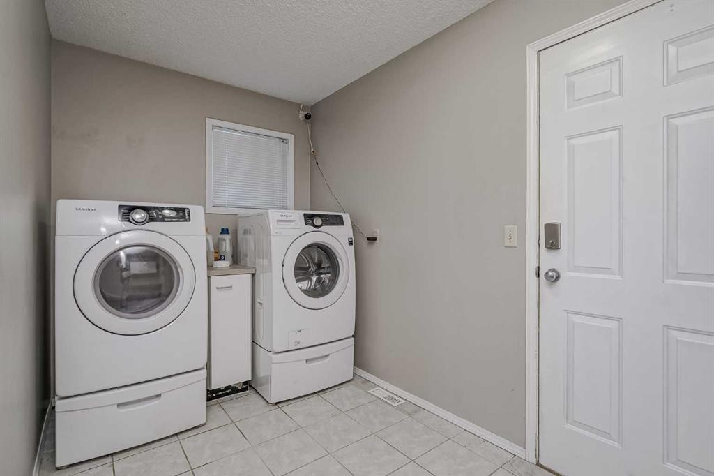8 Millbank Road Sw, Calgary, AB - Indoor Photo Showing Laundry Room