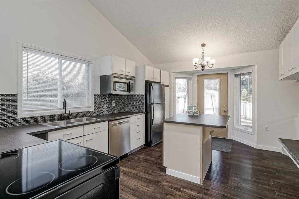 8 Millbank Road Sw, Calgary, AB - Indoor Photo Showing Kitchen With Double Sink