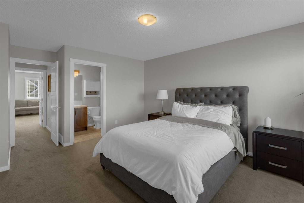 108-2400 Ravenswood View Se, Airdrie, AB - Indoor Photo Showing Bedroom