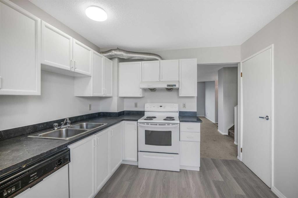 103 Taradale Drive Ne, Calgary, AB - Indoor Photo Showing Kitchen With Double Sink