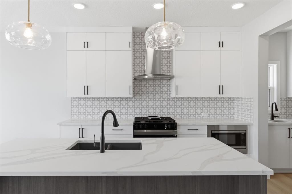 132 Lewiston Drive Ne, Calgary, AB - Indoor Photo Showing Kitchen With Double Sink With Upgraded Kitchen