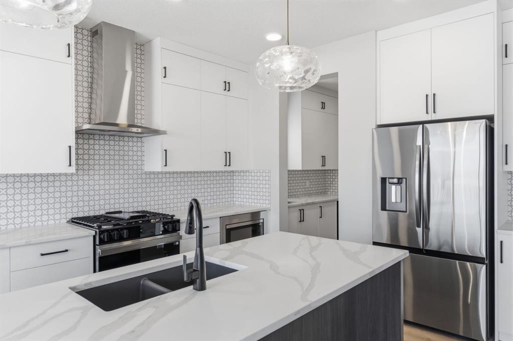 132 Lewiston Drive Ne, Calgary, AB - Indoor Photo Showing Kitchen With Double Sink With Upgraded Kitchen