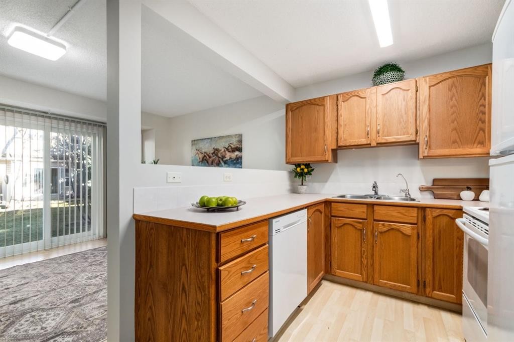 12 Millrise Green Sw, Calgary, AB - Indoor Photo Showing Kitchen With Double Sink