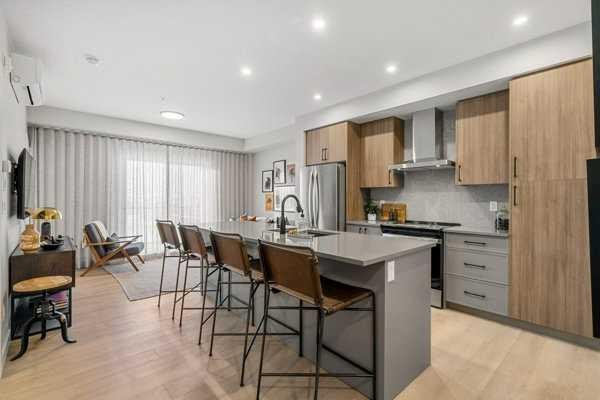 4102-100 Banister Drive, Okotoks, AB - Indoor Photo Showing Kitchen With Upgraded Kitchen