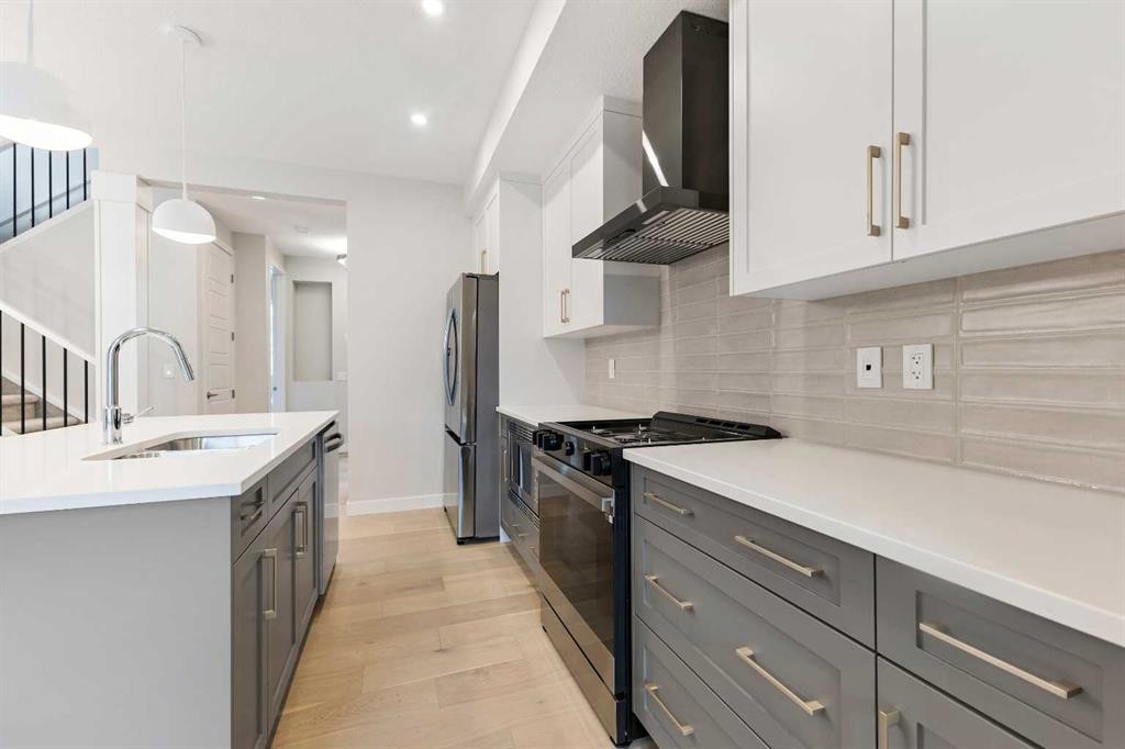 59 Agate Road, Cochrane, AB - Indoor Photo Showing Kitchen With Upgraded Kitchen