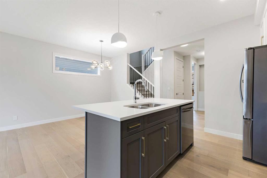 59 Agate Road, Cochrane, AB - Indoor Photo Showing Kitchen With Double Sink