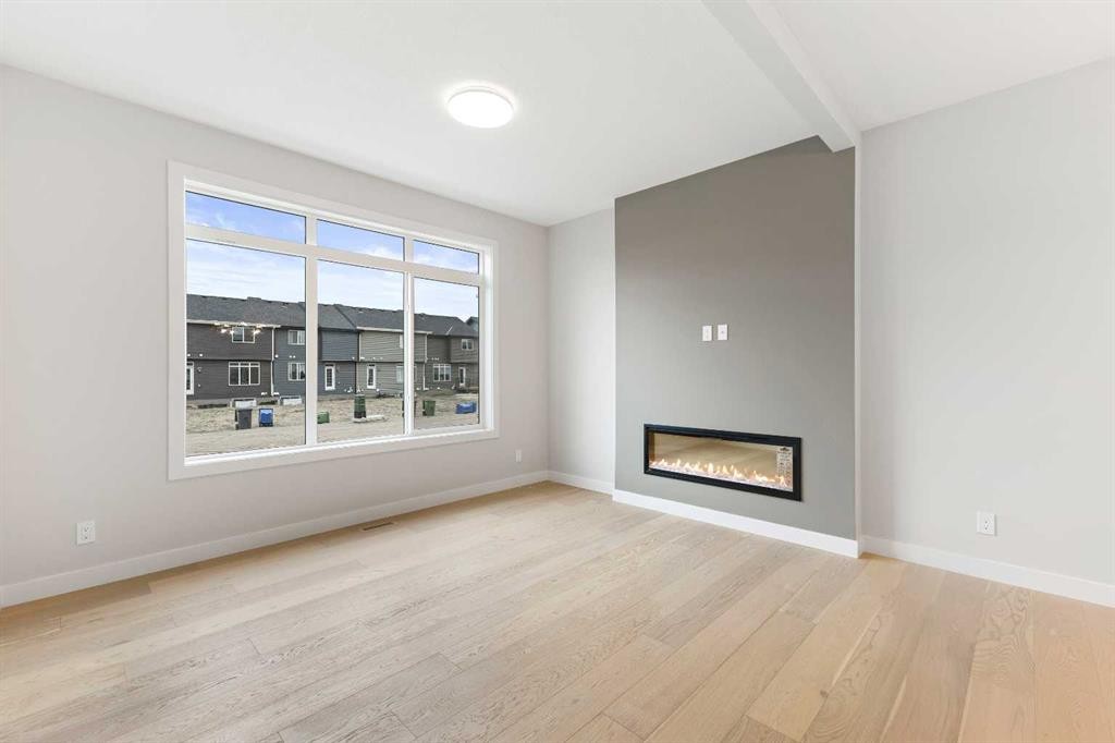 59 Agate Road, Cochrane, AB - Indoor Photo Showing Living Room With Fireplace
