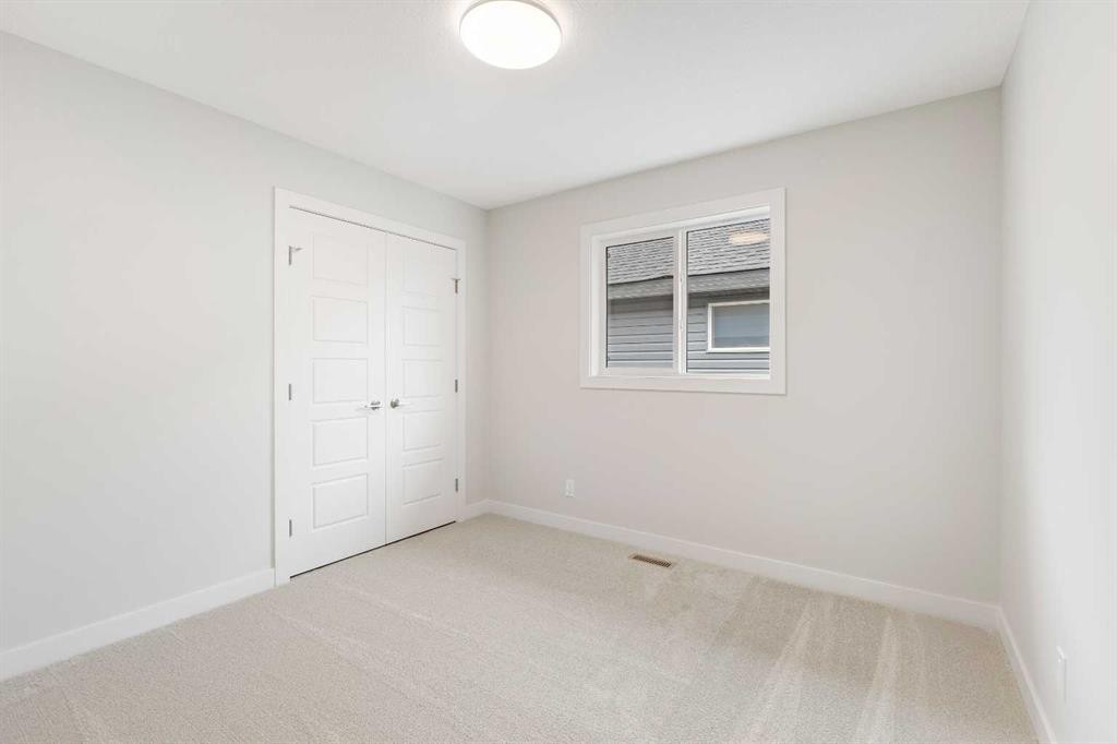 59 Agate Road, Cochrane, AB - Indoor Photo Showing Other Room