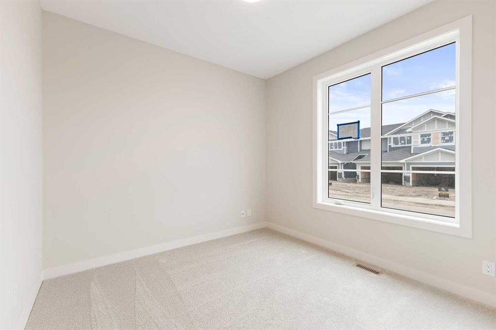 59 Agate Road, Cochrane, AB - Indoor Photo Showing Other Room