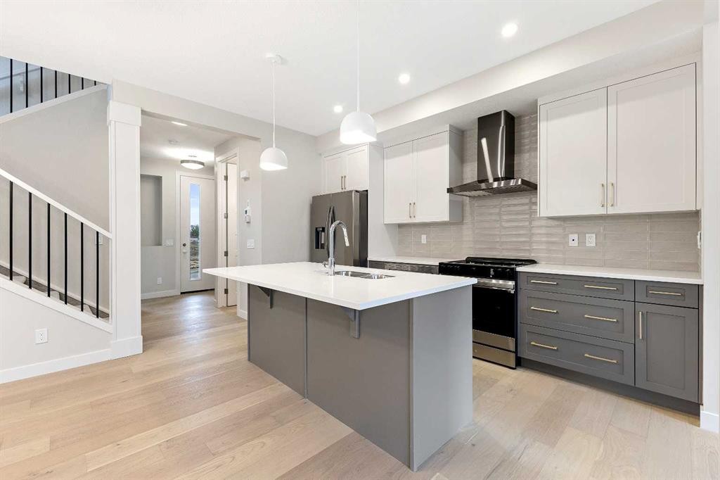 59 Agate Road, Cochrane, AB - Indoor Photo Showing Kitchen With Upgraded Kitchen