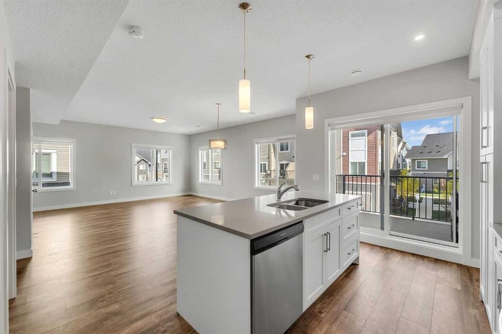 342 Canals Crossing Sw, Airdrie, AB - Indoor Photo Showing Kitchen With Double Sink With Upgraded Kitchen