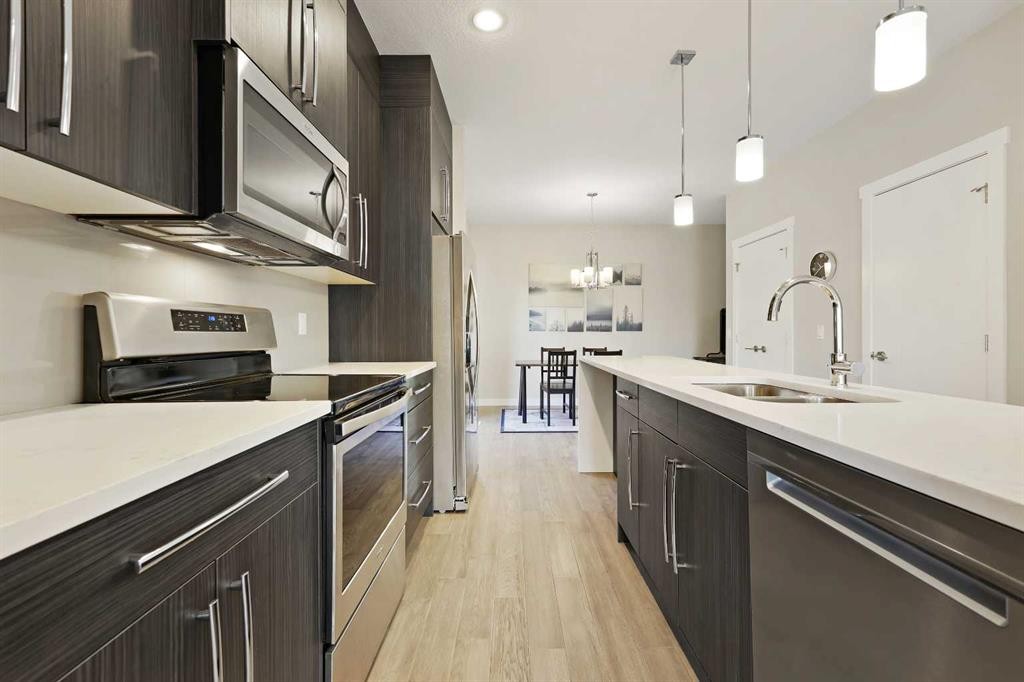 357 Sage Hill Circle Nw, Calgary, AB - Indoor Photo Showing Kitchen With Double Sink With Upgraded Kitchen