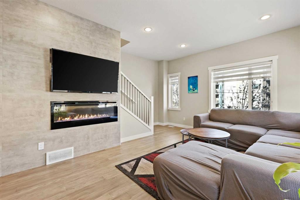 357 Sage Hill Circle Nw, Calgary, AB - Indoor Photo Showing Living Room With Fireplace