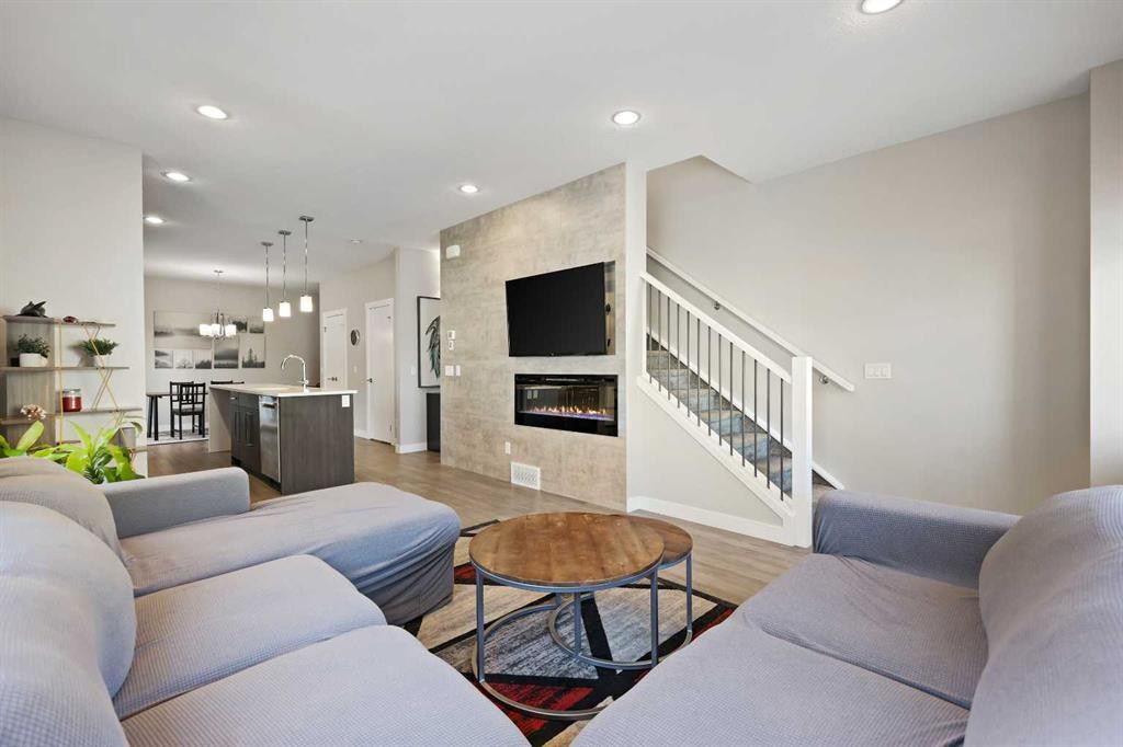 357 Sage Hill Circle Nw, Calgary, AB - Indoor Photo Showing Living Room With Fireplace