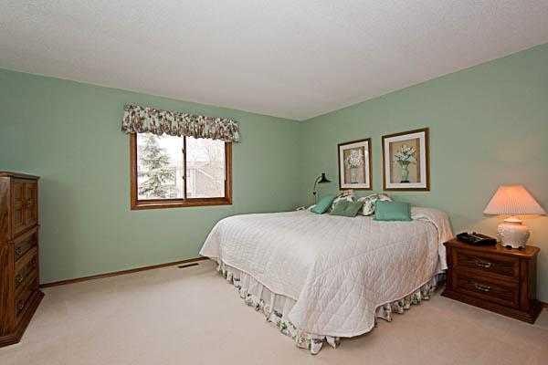 165 Woodford Drive Sw, Calgary, AB - Indoor Photo Showing Bedroom
