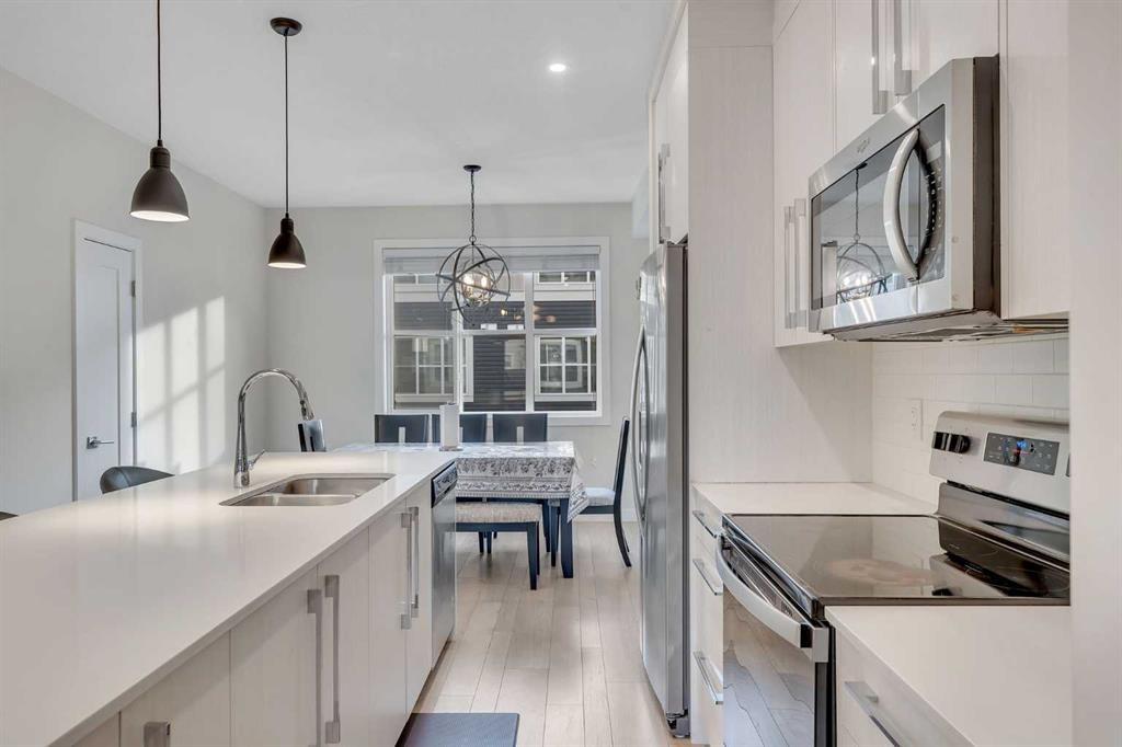 106-72 Cornerstone Manor Ne, Calgary, AB - Indoor Photo Showing Kitchen With Stainless Steel Kitchen With Double Sink With Upgraded Kitchen