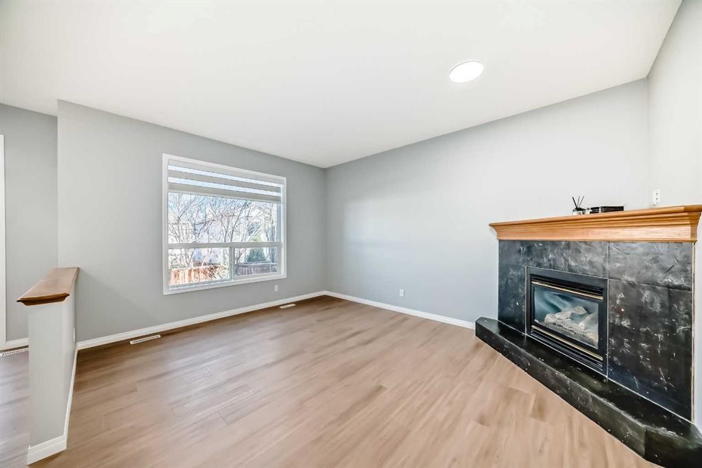 234 Millview Gardens Sw, Calgary, AB - Indoor Photo Showing Other Room With Fireplace