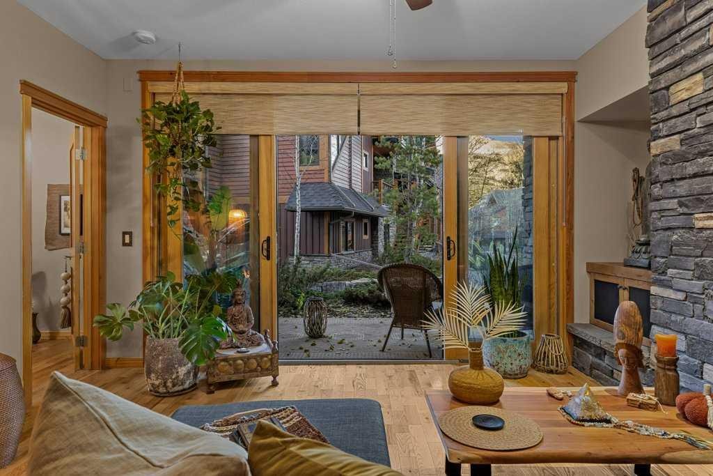 2107-101B Stewart Creek Landing, Canmore, AB - Indoor With Fireplace