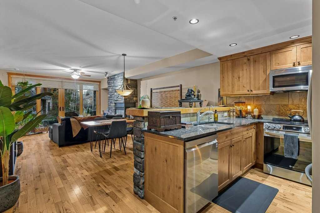2107-101B Stewart Creek Landing, Canmore, AB - Indoor Photo Showing Kitchen