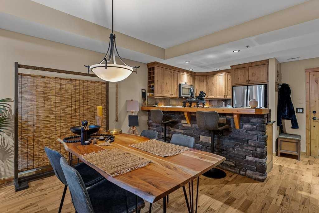 2107-101B Stewart Creek Landing, Canmore, AB - Indoor Photo Showing Dining Room