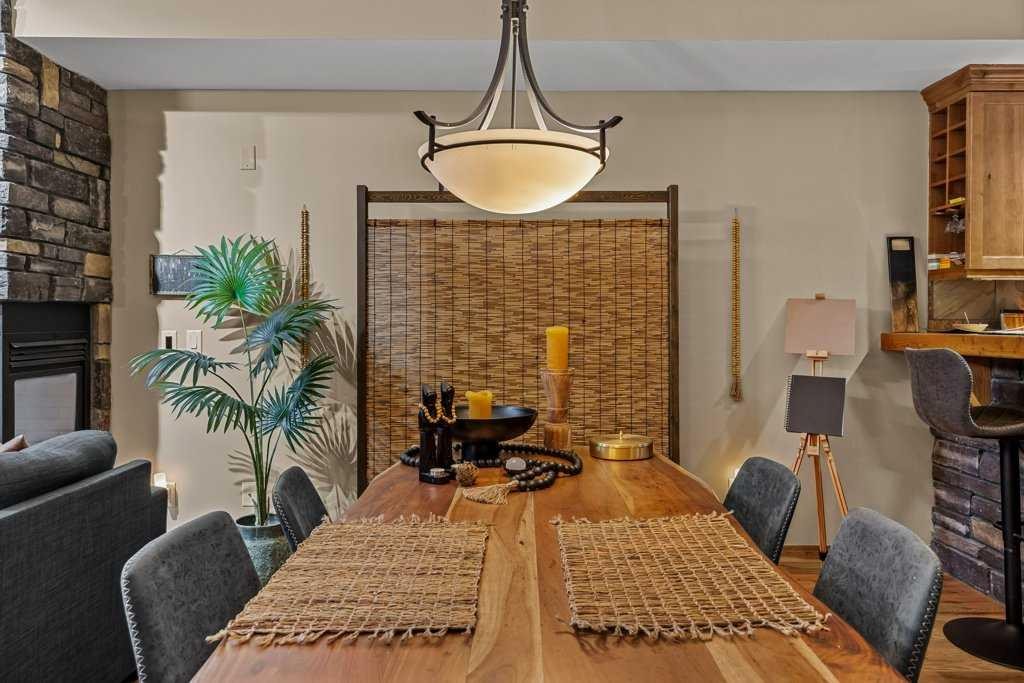 2107-101B Stewart Creek Landing, Canmore, AB - Indoor Photo Showing Dining Room