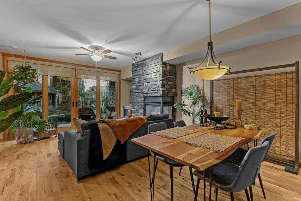 2107-101B Stewart Creek Landing, Canmore, AB - Indoor With Fireplace