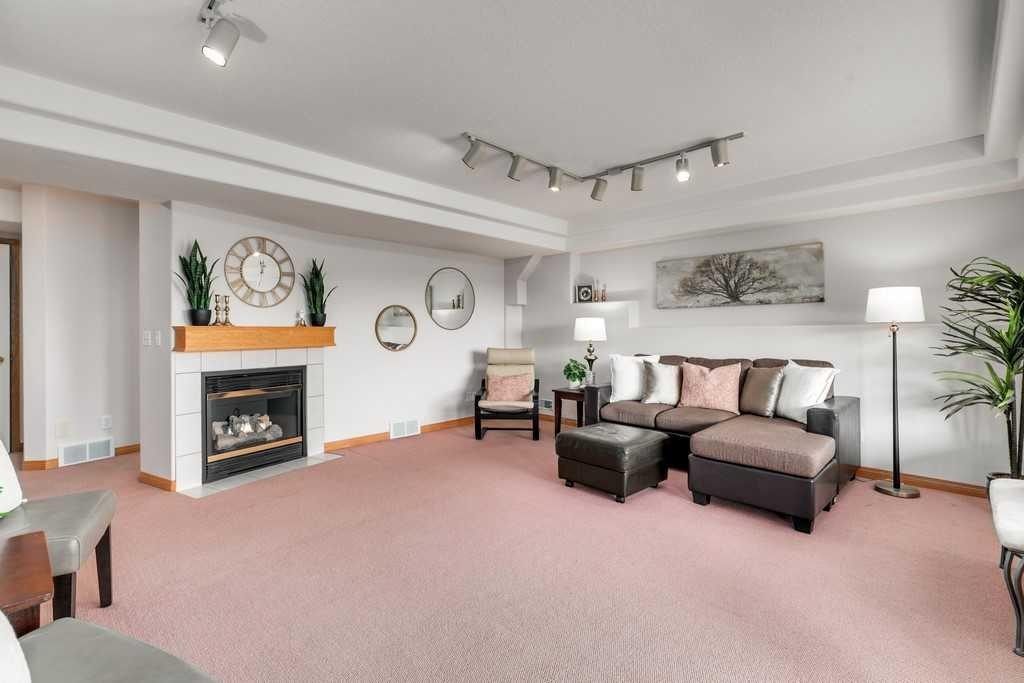 133 Chaparral Ridge Point Se, Calgary, AB - Indoor Photo Showing Living Room With Fireplace