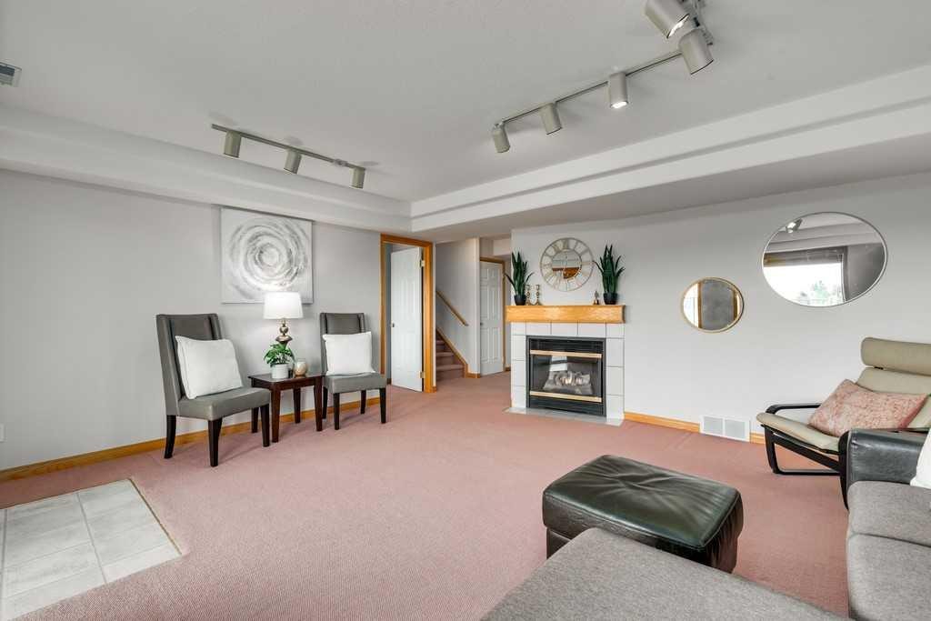 133 Chaparral Ridge Point Se, Calgary, AB - Indoor Photo Showing Living Room With Fireplace