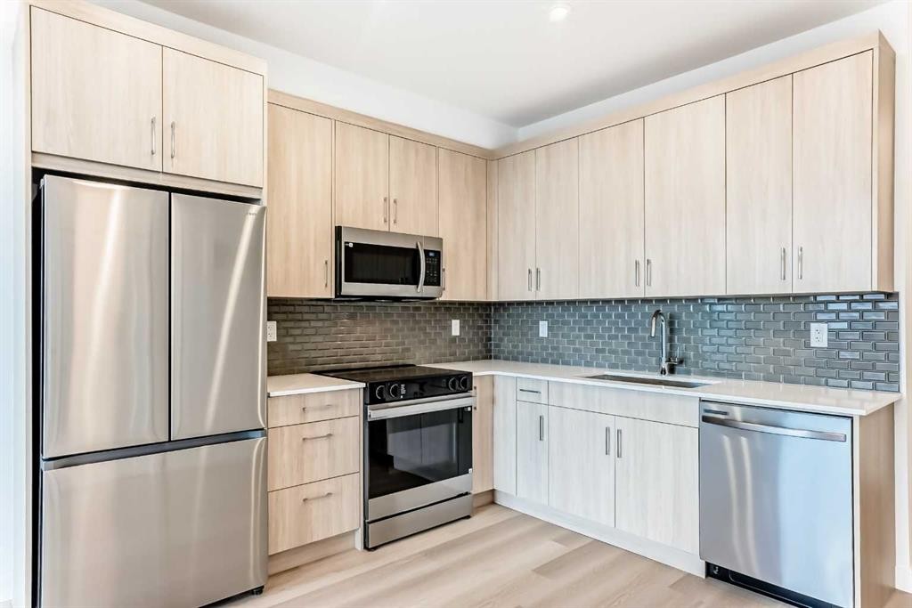 1411-430 Sage Hill Road Nw, Calgary, AB - Indoor Photo Showing Kitchen With Stainless Steel Kitchen With Upgraded Kitchen