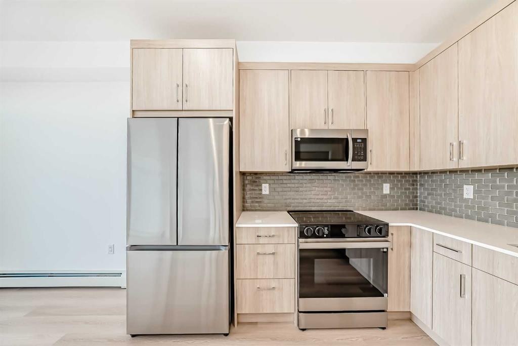 1411-430 Sage Hill Road Nw, Calgary, AB - Indoor Photo Showing Kitchen With Stainless Steel Kitchen With Upgraded Kitchen
