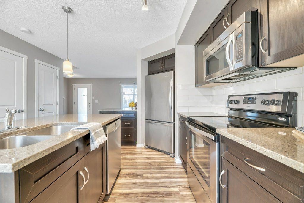 65 Marine Drive Se, Calgary, AB - Indoor Photo Showing Kitchen With Stainless Steel Kitchen With Double Sink With Upgraded Kitchen