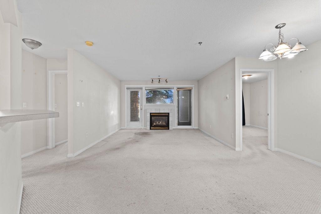 109-4507 45 Street Sw, Calgary, AB - Indoor With Fireplace