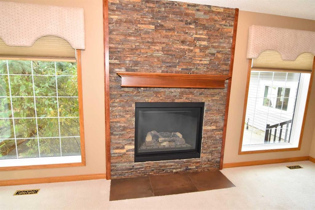 272166 Panorama Road, Rural Rocky View County, AB - Indoor Photo Showing Living Room With Fireplace