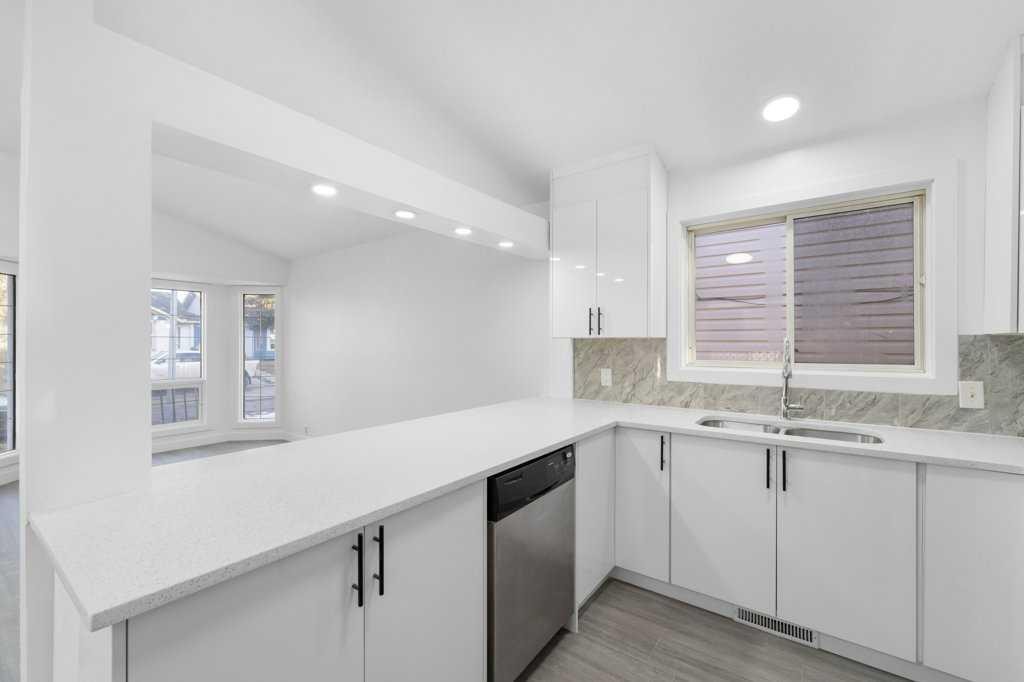 361 Martinwood Place Ne, Calgary, AB - Indoor Photo Showing Kitchen With Double Sink