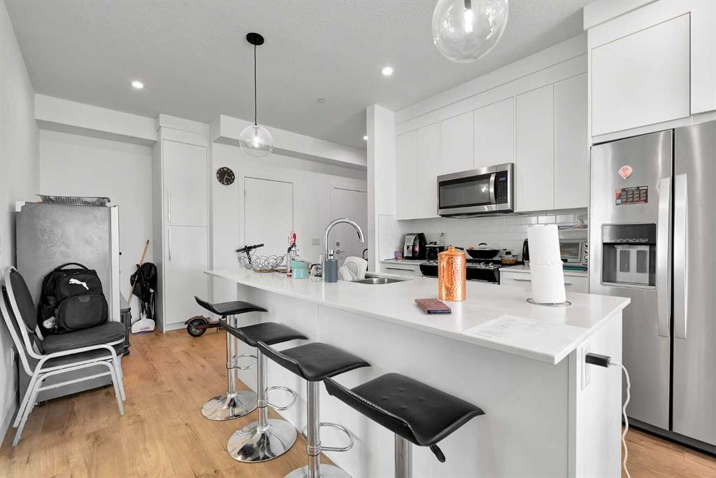 1415-111 Wolf Creek Drive Se, Calgary, AB - Indoor Photo Showing Kitchen With Stainless Steel Kitchen With Upgraded Kitchen