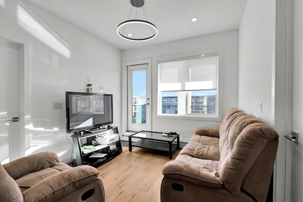 1415-111 Wolf Creek Drive Se, Calgary, AB - Indoor Photo Showing Living Room