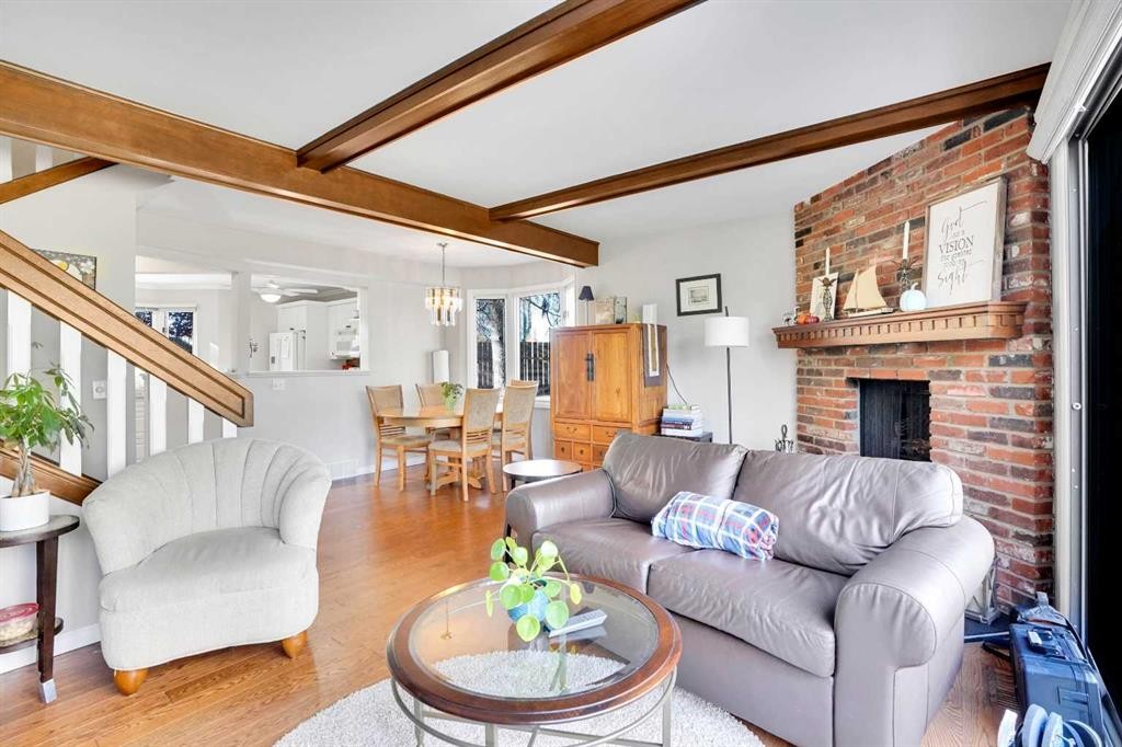 27-10910 Bonaventure Drive Se, Calgary, AB - Indoor Photo Showing Living Room With Fireplace