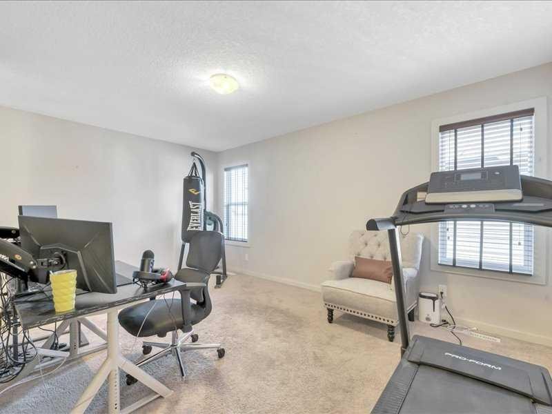 53 Legacy Terrace Se, Calgary, AB - Indoor Photo Showing Gym Room