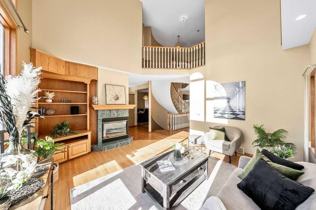 109 Lakeside Greens Drive, Chestermere, AB - Indoor Photo Showing Living Room With Fireplace